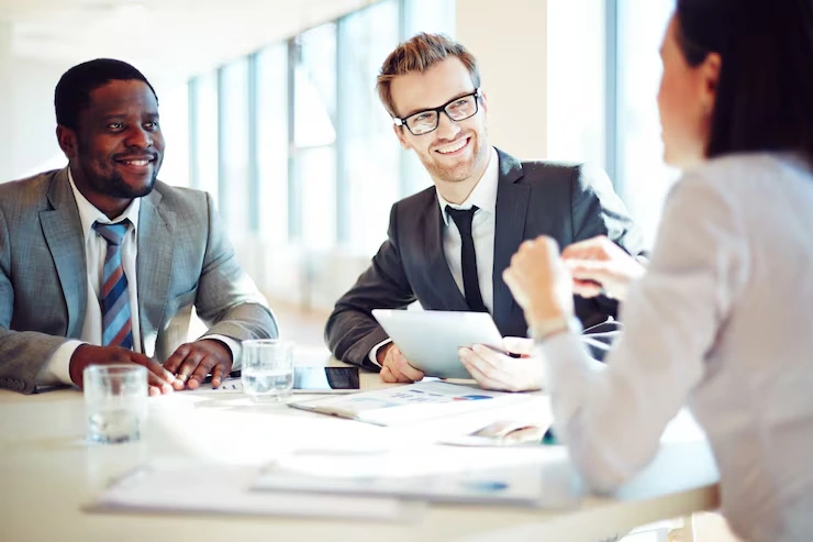 Two consultants reviewing a staffing shortlist together